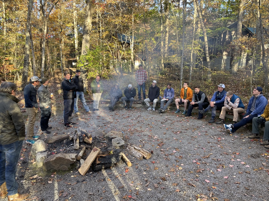Men gathered around the bonfire